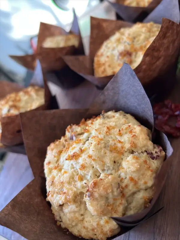 Lemon cranberry muffins surrounded by fresh lemons and cranberries, emphasizing quality ingredients at Mimi Delights bakery in Ottawa.