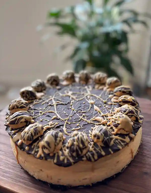 Peanut_Butter_Cheesecake_on_wooden_table_decorated_delivery_in_ottawa