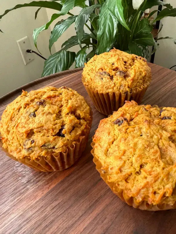 3_morning_glory_muffins_on_the_wooden_table_in_the_humble_setting