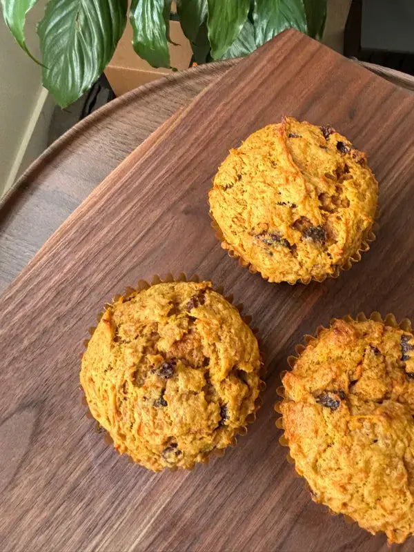 3_morning_glory_muffins_on_the_wooden_tray
